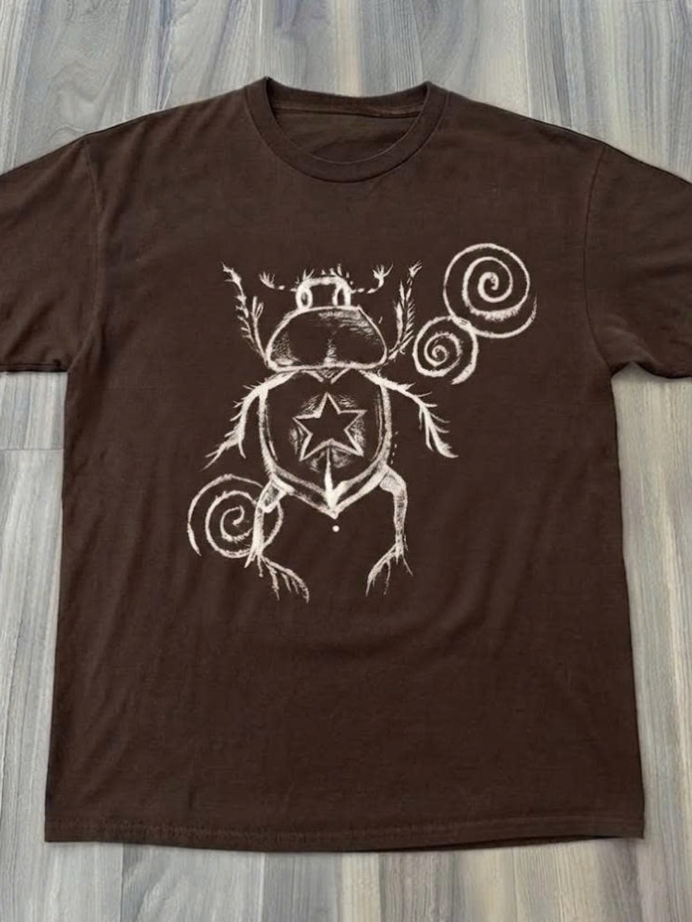 Men's Brown Graphic T-Shirt with White Beetle Star Design